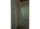 Hallway featuring doors leading to other rooms, freshly painted trim and a glimpse into a living area at 3831 Dillard St, Powder Springs, GA 30127