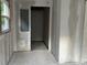 Bright and freshly prepped room leading to another room and with access to an exterior door and window at 3831 Dillard St, Powder Springs, GA 30127