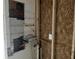 Exposed interior wall with exposed studs, wiring, and plumbing for a room undergoing renovations at 3831 Dillard St, Powder Springs, GA 30127