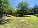 An expansive backyard includes a wooden fence and plenty of space for outdoor activities at 4801 Devonhurst Way, Powder Springs, GA 30127