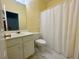 Clean bathroom features white fixtures, marble floors, and a shower-tub combination at 4801 Devonhurst Way, Powder Springs, GA 30127
