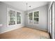 Bright breakfast nook area with large windows and a glass door at 4801 Devonhurst Way, Powder Springs, GA 30127