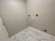 This laundry room features modern marble floors and a door to the outside at 4801 Devonhurst Way, Powder Springs, GA 30127