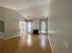 Bright living room features gleaming hardwood floors, fireplace and windows with views to the backyard at 4801 Devonhurst Way, Powder Springs, GA 30127