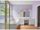 Ensuite bathroom featuring a soaking tub, shower, and double vanity at 4801 Devonhurst Way, Powder Springs, GA 30127