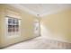 Large main bedroom with carpet flooring and two bright windows at 4801 Devonhurst Way, Powder Springs, GA 30127
