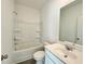 Well-lit bathroom with a shower-tub combo and sleek vanity at 741 Cordele Ln, Sugar Hill, GA 30518