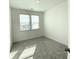 Comfortable bedroom with plush carpet, ample natural light, and neutral decor at 741 Cordele Ln, Sugar Hill, GA 30518
