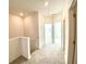 Hallway bathed in natural light, connecting various rooms in the house at 741 Cordele Ln, Sugar Hill, GA 30518