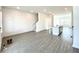 Open-concept living area featuring modern flooring, recessed lights, and a kitchen island at 741 Cordele Ln, Sugar Hill, GA 30518