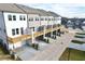 Townhome featuring individual decks, private garages, and modern AC units for each unit at 741 Cordele Ln, Sugar Hill, GA 30518