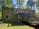 Exterior view of a multilevel deck on a home in a lush backyard at 816 Cedar Lake Se Dr, Conyers, GA 30094