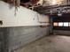 Unfinished basement with cement walls and garage door at 816 Cedar Lake Se Dr, Conyers, GA 30094