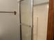Bathroom shower has frosted glass door and chrome trim, as well as a towel rack at 816 Cedar Lake Se Dr, Conyers, GA 30094
