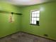 Bedroom with green walls, a window and carpeted floor at 816 Cedar Lake Se Dr, Conyers, GA 30094