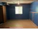 Unfinished bedroom with exposed HVAC, painted walls, trim, and a window at 816 Cedar Lake Se Dr, Conyers, GA 30094