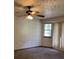 Bedroom featuring ceiling fan, window with blinds, carpet and walls at 816 Cedar Lake Se Dr, Conyers, GA 30094