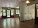 View of a dining room with wood flooring, a chandelier, and a back door at 816 Cedar Lake Se Dr, Conyers, GA 30094