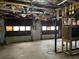 Unfinished garage with two garage doors, cement floors and ceiling at 816 Cedar Lake Se Dr, Conyers, GA 30094