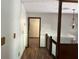 Hallway with wood floors, stairs, wooden railing, and walls at 816 Cedar Lake Se Dr, Conyers, GA 30094