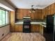 A functional kitchen with wood cabinets, modern appliances, and a view of the yard at 816 Cedar Lake Se Dr, Conyers, GA 30094