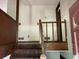 View of a wooden staircase with a partially damaged railing at 816 Cedar Lake Se Dr, Conyers, GA 30094