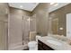 Bathroom featuring a tiled shower and vanity with granite countertop at 935 Grove Valley Drive Dr, Cumming, GA 30041