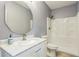 Bathroom boasts decorative mirror, marble countertop, and walk-in shower at 935 Grove Valley Drive Dr, Cumming, GA 30041