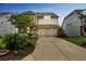 Charming two-story home with well-manicured lawn and a two-car garage at 935 Grove Valley Drive Dr, Cumming, GA 30041