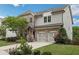 Beautiful two-story home with brick accents, a two-car garage, and a well-maintained front yard at 935 Grove Valley Drive Dr, Cumming, GA 30041