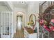 Welcoming foyer with hardwood floors, decorative mirror, and charming decor at 935 Grove Valley Drive Dr, Cumming, GA 30041