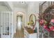 Elegant foyer featuring hardwood floors, decorative molding, and a view of the home's open layout at 935 Grove Valley Drive Dr, Cumming, GA 30041