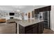 Open kitchen featuring granite countertops, dark cabinets, and stainless steel appliances at 935 Grove Valley Drive Dr, Cumming, GA 30041
