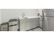 Bright kitchenette with stainless steel appliances, modern countertops, and white cabinets at 935 Grove Valley Drive Dr, Cumming, GA 30041