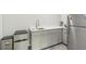 Kitchenette featuring stainless steel fridge, grey cabinets, and stone countertops at 935 Grove Valley Drive Dr, Cumming, GA 30041