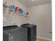 Laundry room with new washer and dryer, tile floor, and wire shelving at 935 Grove Valley Drive Dr, Cumming, GA 30041