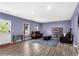 Large living room with hardwood floors, natural light, and comfortable seating at 935 Grove Valley Drive Dr, Cumming, GA 30041