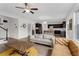 Open-concept living room featuring a view into the kitchen with a center island at 935 Grove Valley Drive Dr, Cumming, GA 30041