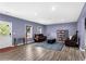 Cozy living room with wood flooring, neutral walls, natural light, and comfortable seating at 935 Grove Valley Drive Dr, Cumming, GA 30041