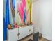 Bright room with colorful wall art and white cabinet at 935 Grove Valley Drive Dr, Cumming, GA 30041