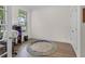 Bright home office with hardwood floors, a window, and a modern round rug at 935 Grove Valley Drive Dr, Cumming, GA 30041