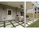Covered patio with comfortable seating, ceiling fan, and backyard access for relaxing outdoors at 935 Grove Valley Drive Dr, Cumming, GA 30041
