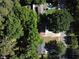 Aerial view of a residential property with mature trees and ample parking at 1150 Goldsmith Rd, Stone Mountain, GA 30083