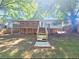 View of the back of the home with a porch, stairway, and unfinished basement at 1150 Goldsmith Rd, Stone Mountain, GA 30083