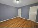 Bedroom with hardwood floors offers a simple yet stylish interior design with ample natural light at 1150 Goldsmith Rd, Stone Mountain, GA 30083