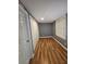 Bedroom features a window, hardwood floors, and a closet for ample storage at 1150 Goldsmith Rd, Stone Mountain, GA 30083