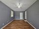 Simple bedroom with hardwood flooring, a window and an off-set doorway at 1150 Goldsmith Rd, Stone Mountain, GA 30083