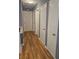 Hallway features beautiful hardwood floors and access to multiple rooms in the home at 1150 Goldsmith Rd, Stone Mountain, GA 30083