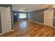 Living area with hardwood floors, ceiling fan, and natural light streaming through the window at 1150 Goldsmith Rd, Stone Mountain, GA 30083