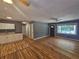 Open-concept living area with hardwood floors, ceiling fan, and natural light at 1150 Goldsmith Rd, Stone Mountain, GA 30083